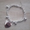 PULSERA DE ACERO BLANCO TOURBILLON CON BOLITAS Y DIJE CORAZON CON NACAR Y FRASE PENSAR MENOS. LARGO 17 + 3 CM