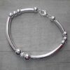 PULSERA DE ACERO BLANCO COMBINADA TUBOS Y BOLITAS. LARGO 18.5 CM