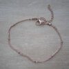 PULSERA DE ACERO DORADO ROSE MALLA PLANA CON BOLITAS. LARGO 17,5 + 4 CM EXT.