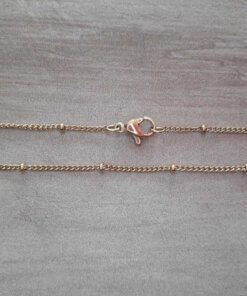 CADENA DE ACERO DORADO GRUMET 0,4 CON BOLITAS.