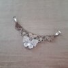 DIJE DE ACERO 5 MARIPOSAS CON MARIPOSA DE STRASS BLANCO. 46 X 21 MM