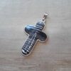 DIJE DE ACERO CRUZ CON PIEDRA BLANCA CON RAYAS NEGRAS 30 X 50 MM