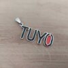 DIJE DE ACERO FRASE " TUYO " ESMALTADO EN NEGRO Y ROJO. 15 X 40 MM