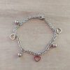 PULSERA DE ACERO ESLABÓN TIFFANY CON BOLITAS Y DIJES DE CORAZONES CALADOS. LARGO 18,5 CM