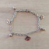 PULSERA DE ACERO ESLABÓN TIFFANY CON BOLITAS Y DIJES DE OJO TURCO. LARGO 18,5 CM