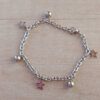 PULSERA DE ACERO ESLABÓN TIFFANY CON BOLITAS Y DIJES DE ESTRELLAS CALADAS. LARGO 18,5 CM