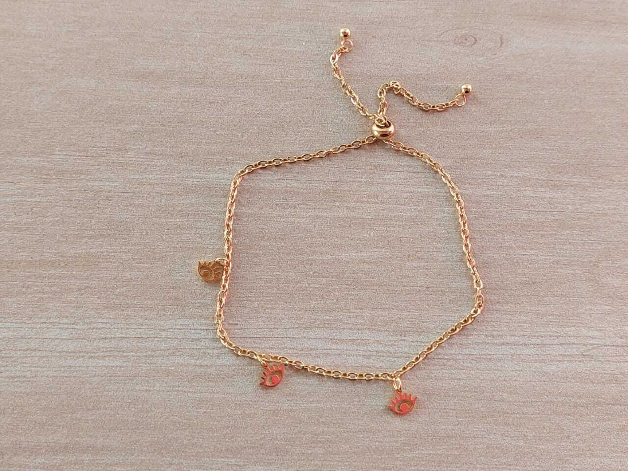 PULSERA AJUSTABLE DE ACERO DORADO ESPEJITO CON TRES OJITOS TURCOS
