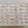 ANILLOS DE ACERO DORADO FORMAS CALADAS X 36 UNIDADES SURTIDOS EN MEDIDAS. (MEDIDAS DEL 16 AL 19