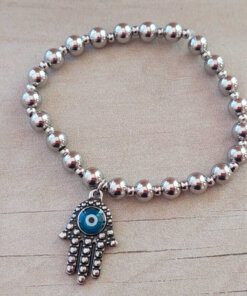 PULSERA DE ACERO ELASTIZADA CON BOLITAS 6 MM Y DIJE MANO DE FATIMA.
