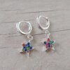 ARO DE ACERO BLANCO ARGOLLA 10 MM CON BISAGRA Y STRASS CON DIJE ESTRELLA C/STRASS MULTICOLOR.