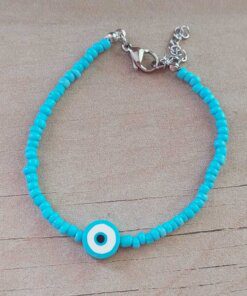 PULSERA DE TANZA CON MOSTACILLAS CELESTE Y OJO TURCO CON TERMINAL DE ACERO. LARGO 18 + 3 CM EXT.