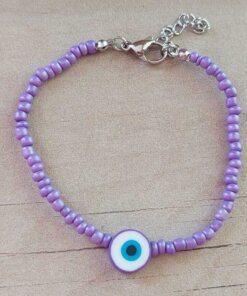 PULSERA DE TANZA CON MOSTACILLAS VIOLETA Y OJO TURCO CON TERMINAL DE ACERO. LARGO 18 + 3 CM EXT.