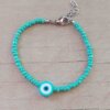 PULSERA DE TANZA CON MOSTACILLAS VERDE AGUA Y OJO TURCO CON TERMINAL DE ACERO. LARGO 18 + 3 CM EXT.