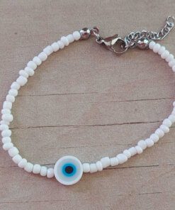 PULSERA DE TANZA CON MOSTACILLAS BLANCA Y OJO TURCO CON TERMINAL DE ACERO. LARGO 18 + 3 CM EXT.