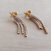 ARO DE ACERO DORADO ESTRELLA CON TRIPLE CADENA DE STRASS BLANCO COLGANTE. LARGO TOTAL 37 MM