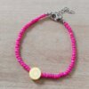 PULSERA DE TANZA CON MOSTACILLAS FUCSIA Y LIMÓN CON TERMINAL DE ACERO. LARGO 17 + 3 CM EXT.