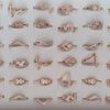 ANILLOS DE ACERO DORADO VARIOS STRASS X 36 UNIDADES SURTIDOS EN MEDIDAS Y MODELOS. (MEDIDAS DEL 16 AL 19)
