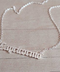 COLGANTE DE ACERO BLANCO ESLABÓN ESPEJITO CON DIJE DE SIGNOS ZODIACALES . LARGO 43 CM + 5 CM EXT.