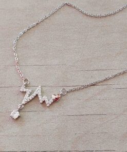 COLGANTE DE ACERO BLANCO ESLABÓN ESPEJITO 0.4 CON CENTRO SIGNO VITAL C/STRASS Y CUBIK COLGANTE. LARGO 45 CM + 5 CM EXT.