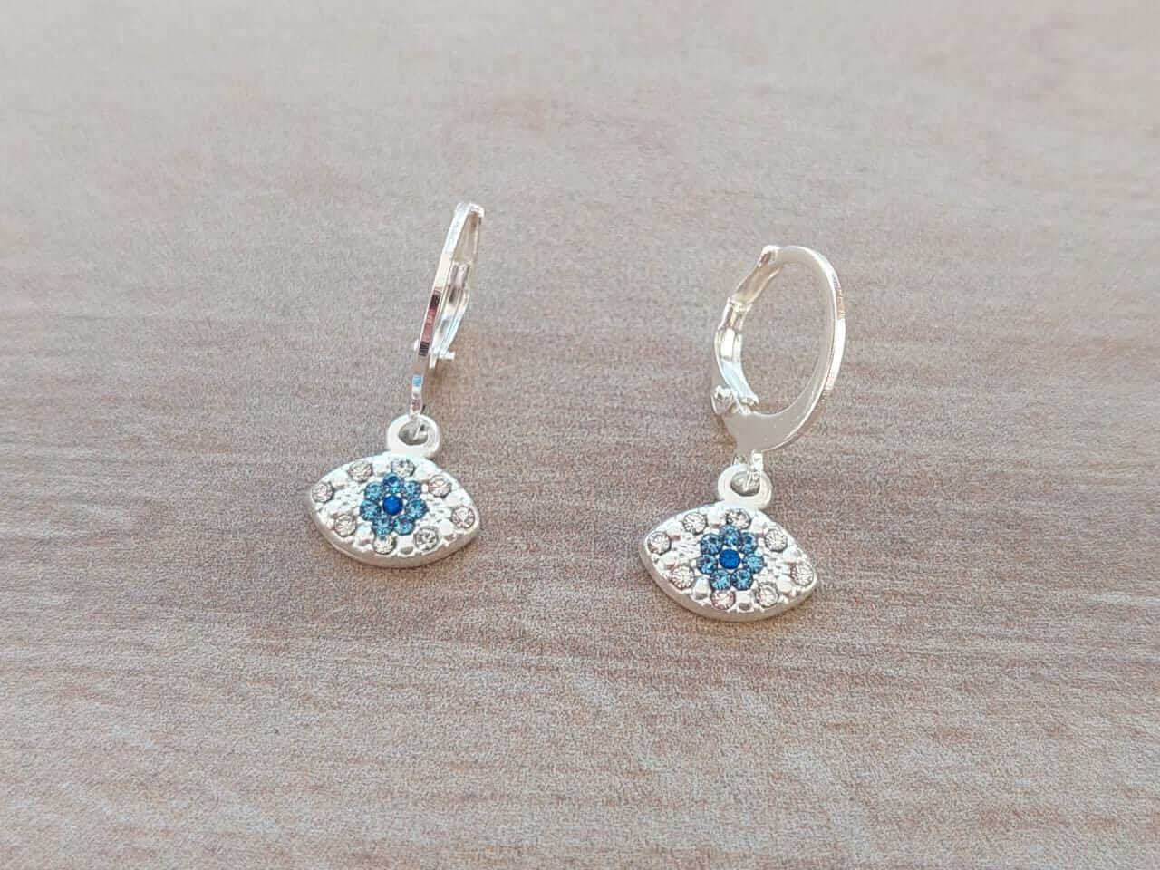 ARO DE ACERO BLANCO BRISURA CON DIJE OJO C/STRASS. LARGO TOTAL 23 MM