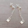 ARO DE ACERO BLANCO BOLITA CON TIRA DE CADENA Y CANDADO COLGANTE. LARGO TOTAL 35 MM