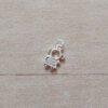 DIJE DE ACERO BLANCO NENA CON STRASS BLANCO. MICROPAVE. MEDIDAS APROX 7 X 10 MM