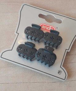 PACK DE 12 BLISTER BROCHES DE PLÁSTICO 25 MM CON FLORCITAS CALADAS X 4 UNIDADES COLOR NEGRO.