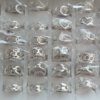 ANILLO DE ACERO BLANCO ANCHOS, 6 MODELOS X 36 UNIDADES. NUMERO 17 (24 UNID) Y NUMERO 19 (12 UNID)