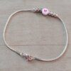 PULSERA DE ACERO BLANCO COLA DE RATON CON BOLITAS Y APLIQUE BLANCO PASANTE CON CORAZON FUCSIA. LARGO 19 CM.