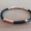 PULSERA DE CAUCHO REGULABLE CON CENTRO EN ACERO NEGRO Y ACERO ROSE TRABAJADO