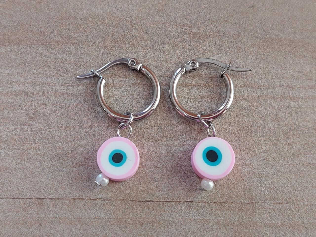 ARO DE ACERO ARGOLLA 14 MM CON DIJE OJO TURCO ROSA COLGANTE.