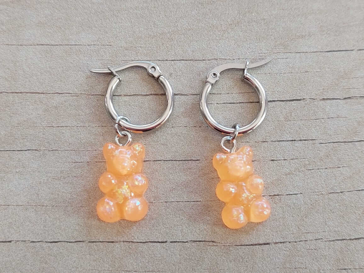 ARO DE ACERO ARGOLLA 14 MM CON DIJE OSITO GUMMY ACRÍLICO NARANJA COLGANTE.