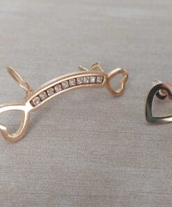 ARO DE ACERO DORADO TREPADOR CON TIRA DE STRASS Y CORAZONES Y SOLITARIO CORAZÓN.