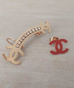 ARO DE ACERO DORADO TREPADOR CON TIRA DE STRASS Y SÍMBOLO CHANEL CON SOLITARIO CHANEL.