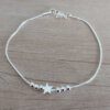 PULSERA DE ACERO BLANCO COLA DE RATON CON BOLITAS Y DIJE DE ESTRELLA PASANTE. LARGO 19 CM.