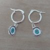 ARO DE ACERO BLANCO ARGOLLA 15 MM CON DIJE OJO ESMALTADO COLGANTE. LARGO TOTAL 31 MM