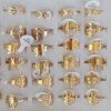 ANILLOS DE ACERO DORADO FIGURAS X 36 UNIDADES SURTIDOS EN MEDIDAS. (MEDIDAS DEL 16 AL 21)
