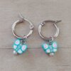 ARO DE ACERO ARGOLLA 14 MM CON DIJE MARIPOSA CELESTE COLGANTE