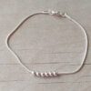 PULSERA DE ACERO BLANCO COLA DE RATÓN CON BOLITAS. LARGO 19 CM