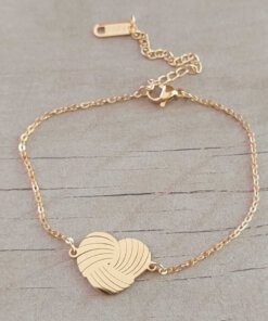PULSERA DE ACERO DORADO ESLABÓN ESPEJITO CON CENTRO CORAZÓN. LARGO 18 CM + 4 CM EXT.