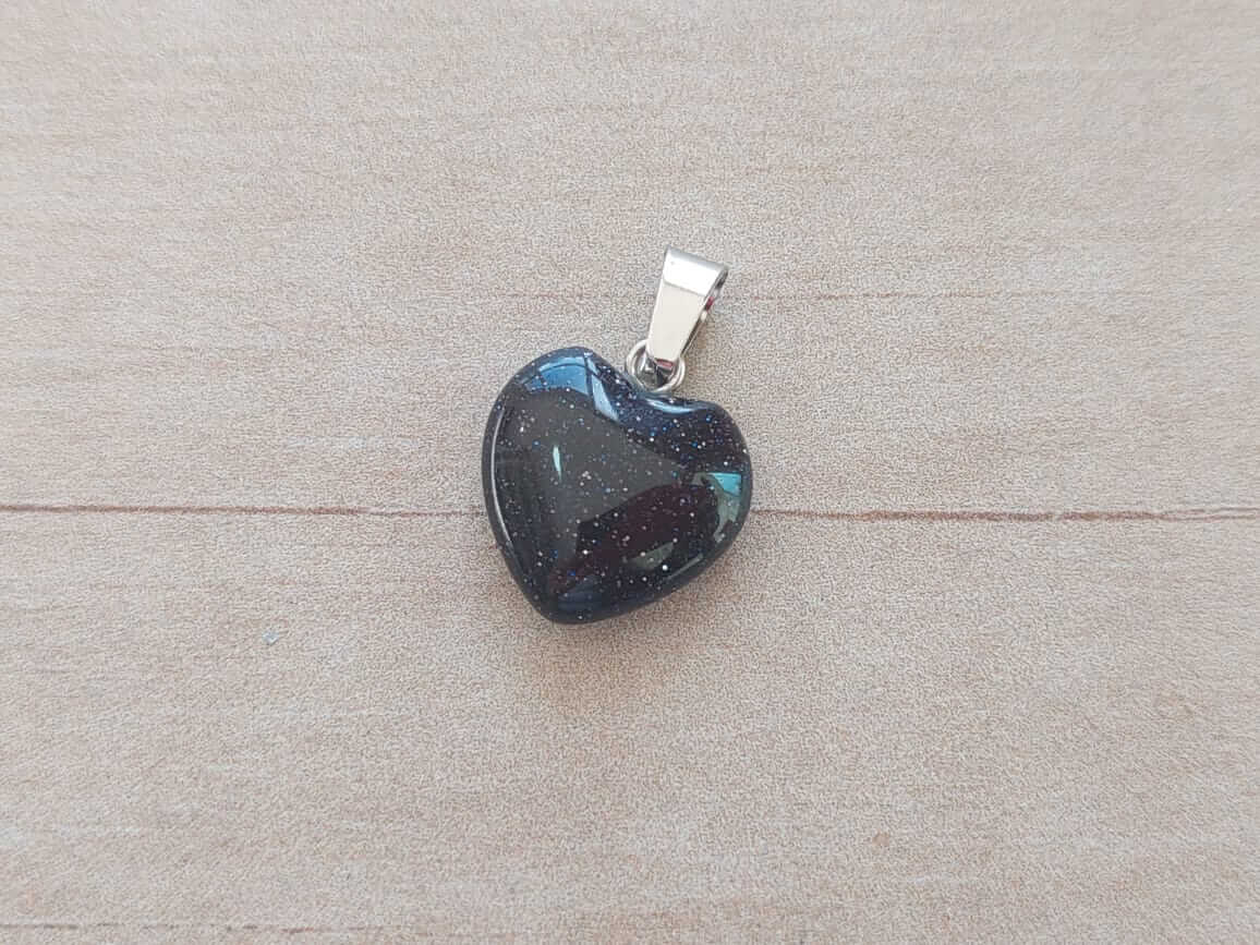 DIJE DE ACERO LLUVIA DE ESTRELLAS EN FORMA DE CORAZÓN. 15 MM