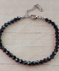 PULSERA DE TANZA CON MOSTACILLAS NEGRA Y TERMINAL DE ACERO.  LARGO 18 + 3.5 CM  EXT.