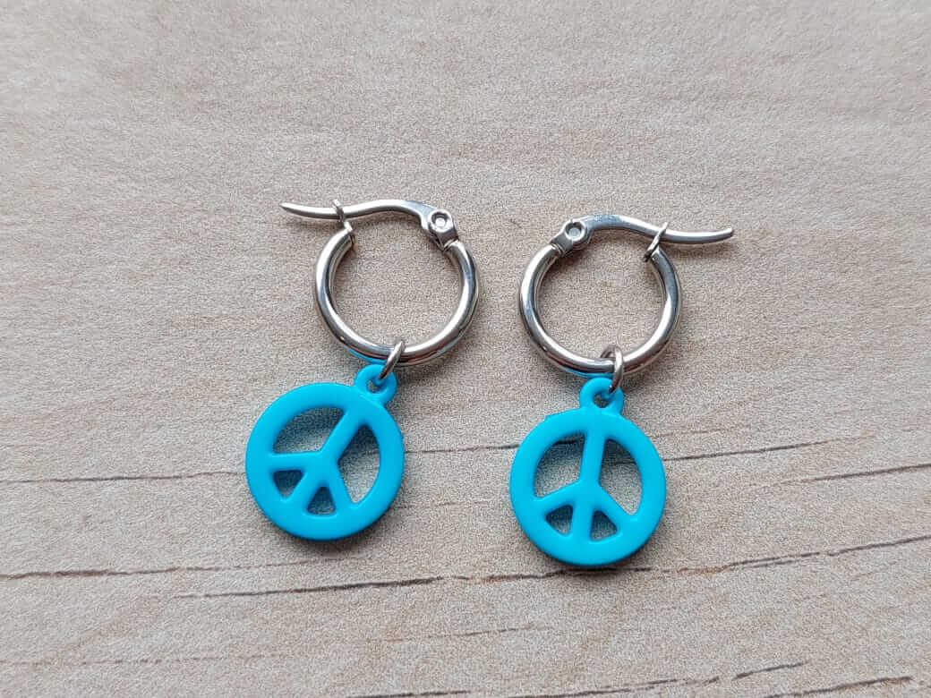 ARO DE ACERO ARGOLLA 14 MM CON DIJE SÍMBOLO DE LA PAZ COLGANTE TURQUESA