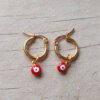 ARO DE ACERO DORADO ARGOLLA 14 MM CON OJO TURCO ROJO