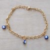 PULSERA DE ACERO DORADO ESLABÓN TIFFANY DIAMANTADA CON OJITOS AZULES ESMALTADOS COLGANTES. LARGO 19 CM