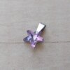 DIJE DE ACERO ESTRELLA DE MAR 16 MM DE ACRÍLICO LILA TORNASOLADO.