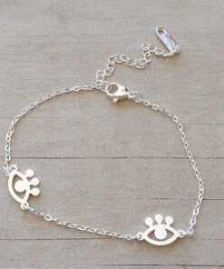 PULSERA DE ACERO BLANCO ESPEJITO CON DOS OJITOS TURCOS CALADOS EN EL CENTRO. LARGO 18 CM + 5 CM EXT