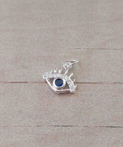 DIJE DE ACERO BLANCO OJO CON STRASS BLANCO Y CENTRO AZUL. MEDIDAS 10 MM