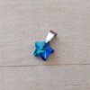 DIJE DE ACERO ESTRELLA 14 MM DE ACRÍLICO TURQUESA TORNASOLADO.
