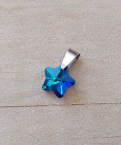DIJE DE ACERO ESTRELLA 14 MM DE ACRÍLICO TURQUESA TORNASOLADO.